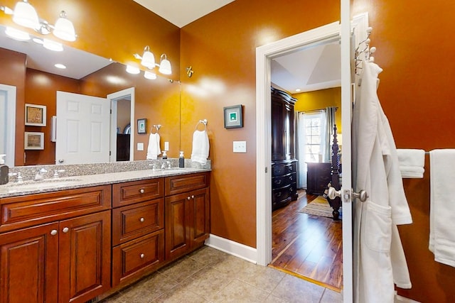 bathroom with vanity and tile patterned floors