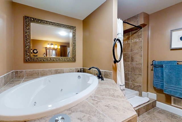 bathroom with shower with separate bathtub