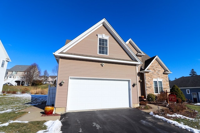 front facade with a garage