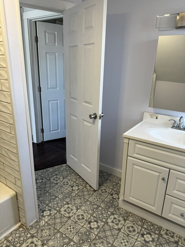 bathroom featuring vanity and a bathing tub