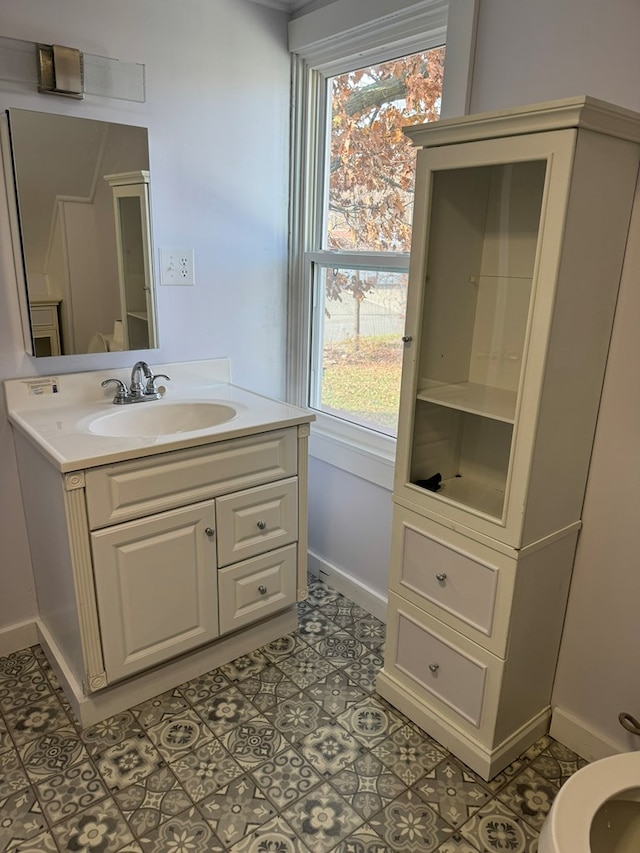 bathroom with vanity, tile patterned floors, and a healthy amount of sunlight