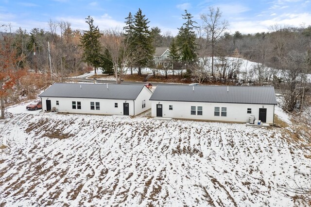 view of snow covered house