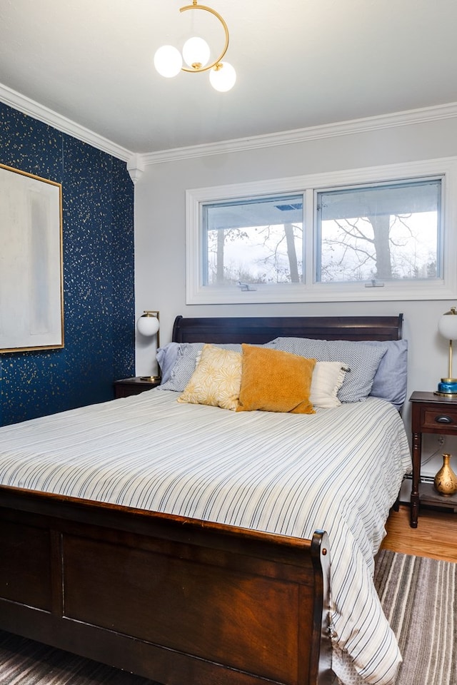 bedroom featuring hardwood / wood-style flooring and ornamental molding