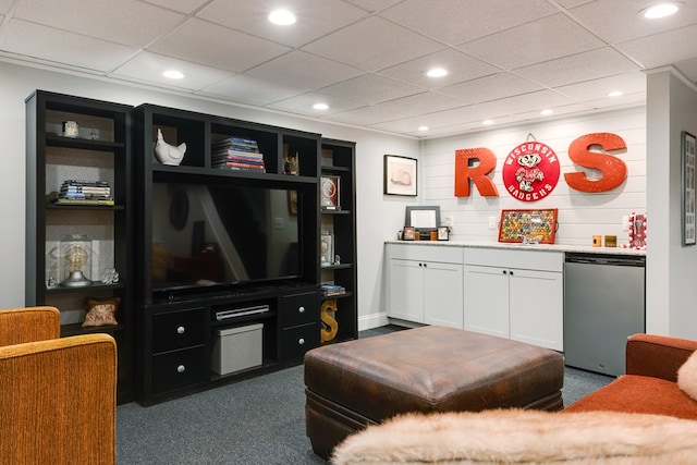 carpeted living room with a drop ceiling