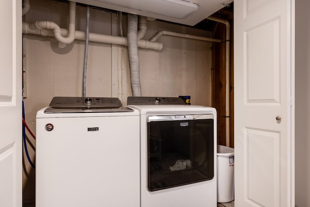 washroom with independent washer and dryer