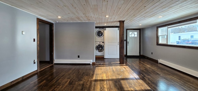 laundry room featuring stacked washer / drying machine, wooden ceiling, dark hardwood / wood-style floors, and baseboard heating