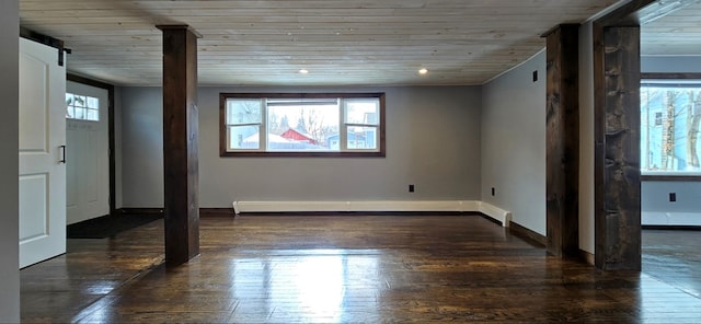 unfurnished room with wood ceiling, a baseboard radiator, a healthy amount of sunlight, and dark wood-type flooring