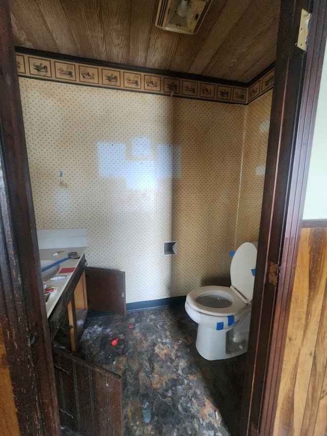 bathroom featuring wood ceiling and toilet