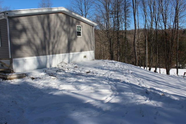 view of snow covered property