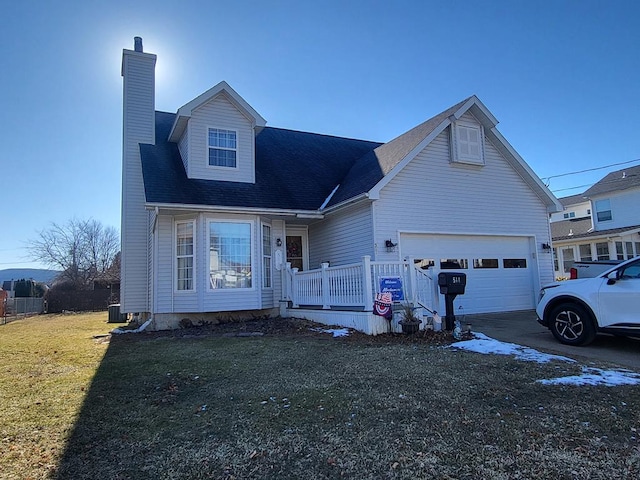 view of front facade featuring a garage and a front lawn