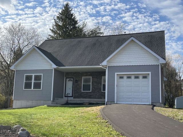 view of front facade with a garage and a front lawn