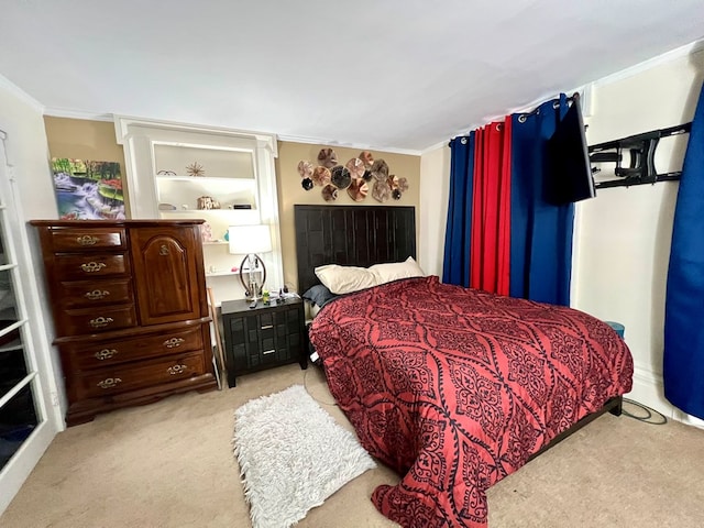 bedroom featuring ornamental molding and light colored carpet