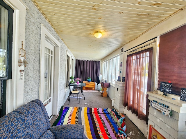 sunroom / solarium featuring wooden ceiling