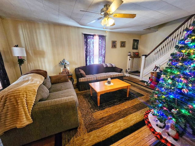 living room with hardwood / wood-style flooring and ceiling fan