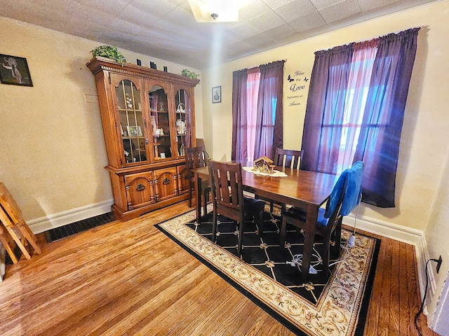 dining area featuring wood-type flooring