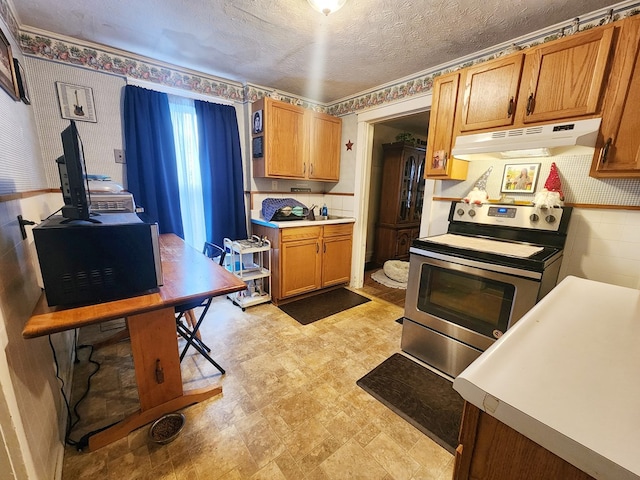 kitchen with electric range and a textured ceiling