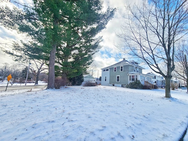 view of yard layered in snow