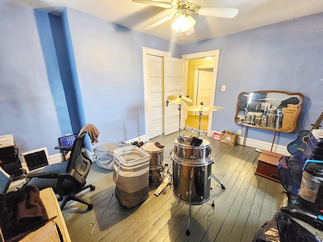 interior space with ceiling fan and hardwood / wood-style floors