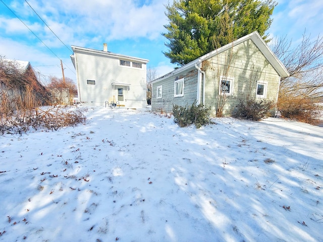 view of snow covered house