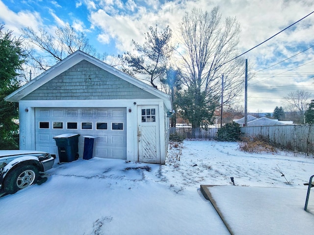 view of snow covered garage