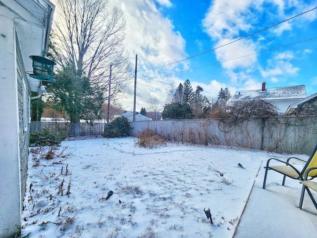 view of yard covered in snow