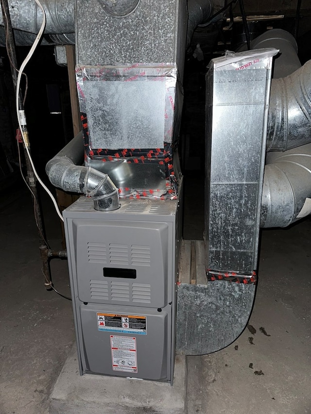 utility room with heating unit