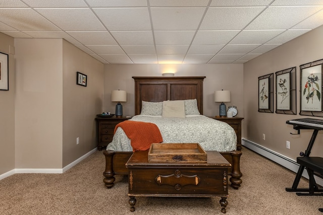 bedroom with a baseboard radiator, a paneled ceiling, and light carpet