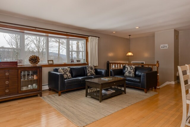 living room featuring light hardwood / wood-style floors and baseboard heating