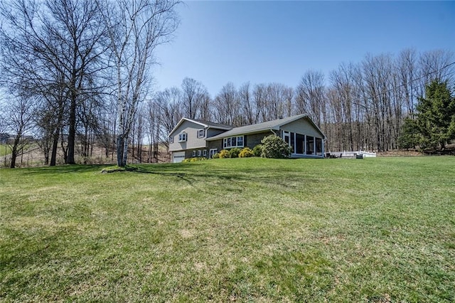 exterior space with a yard and a sunroom