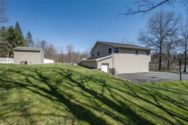 view of side of home featuring a lawn