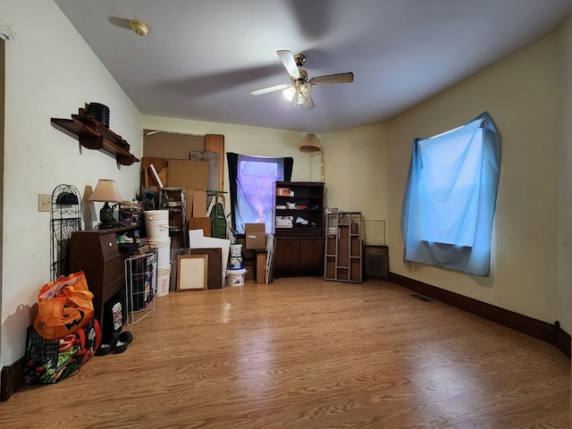 miscellaneous room featuring ceiling fan and light wood-type flooring