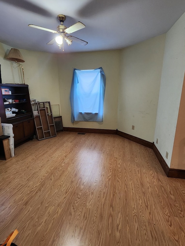 interior space featuring ceiling fan and light hardwood / wood-style flooring