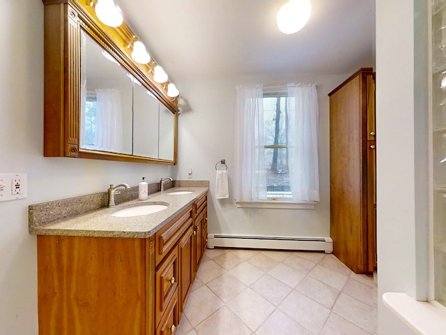 bathroom featuring a baseboard radiator, vanity, and tile patterned flooring