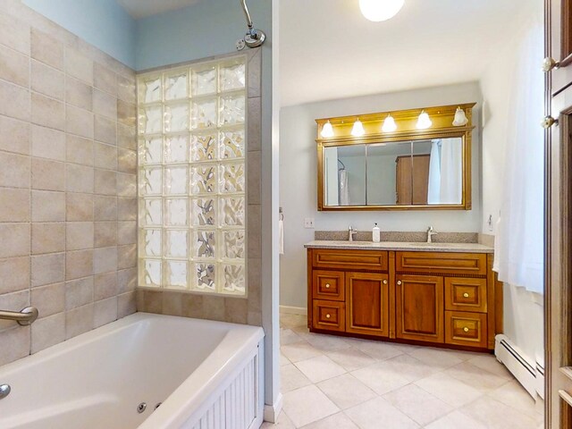 bathroom featuring tile patterned floors, vanity, a bathtub, and a baseboard heating unit