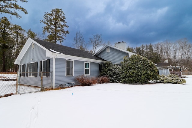 view of snow covered exterior featuring a sunroom