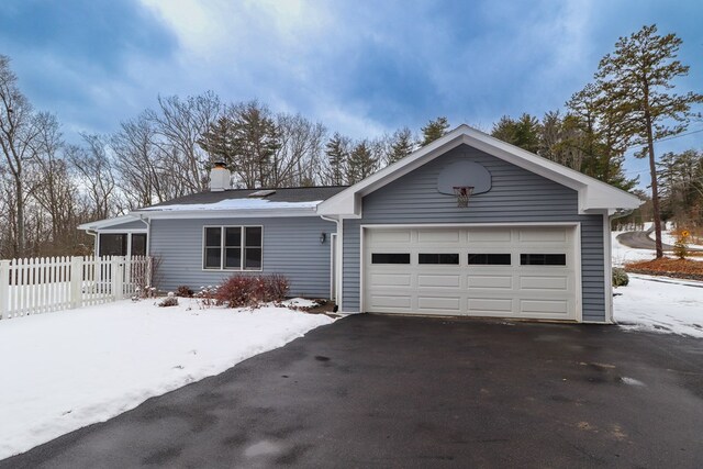 ranch-style house featuring a garage