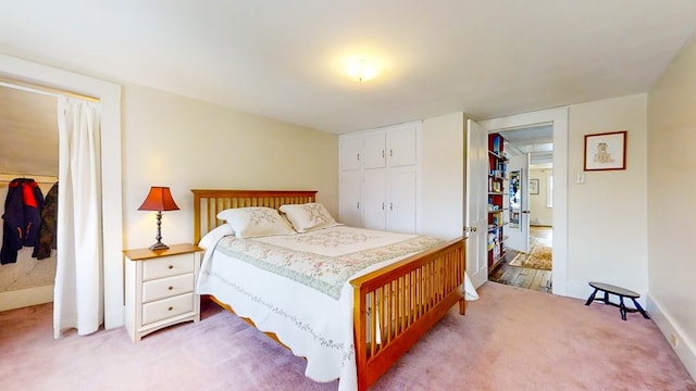 carpeted bedroom with a closet