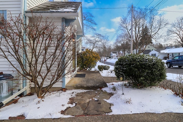 view of yard layered in snow