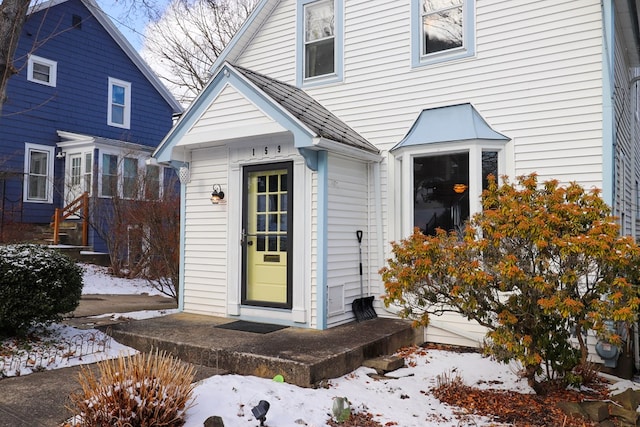 view of snow covered property entrance