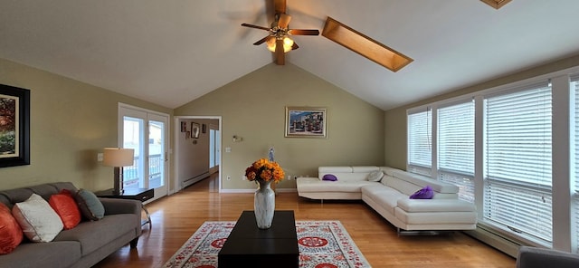 living room with ceiling fan, a baseboard radiator, light hardwood / wood-style floors, and vaulted ceiling with beams