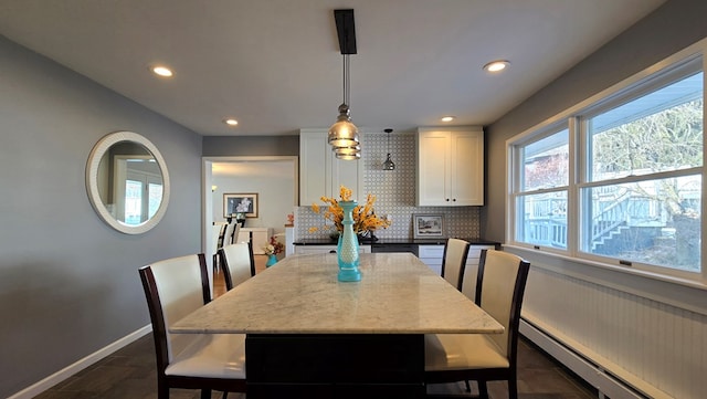 dining room with a baseboard radiator