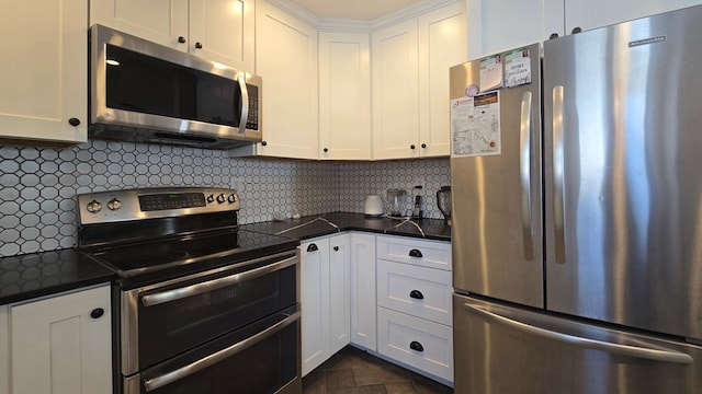 kitchen with white cabinetry, backsplash, and appliances with stainless steel finishes