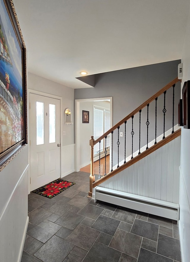 entryway featuring a baseboard radiator and plenty of natural light