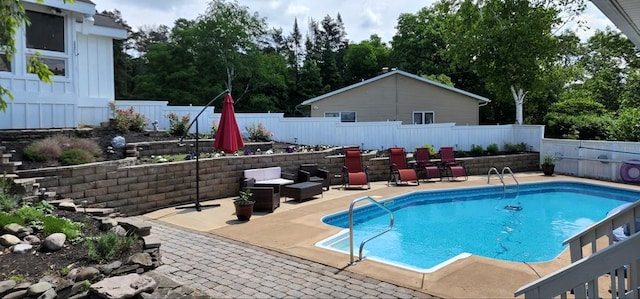 view of swimming pool with a patio