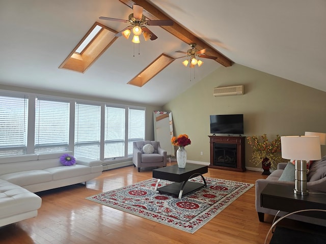 living room with hardwood / wood-style flooring, lofted ceiling with skylight, a wall unit AC, and a baseboard heating unit