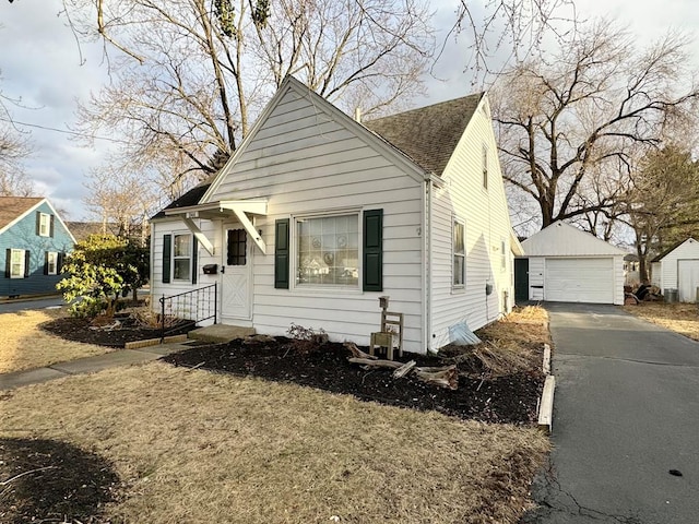 bungalow-style home with an outbuilding and a garage