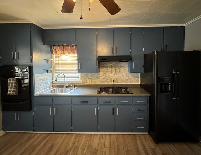 kitchen with sink, gray cabinets, black appliances, and light wood-type flooring