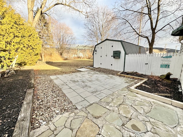 view of patio / terrace with a shed