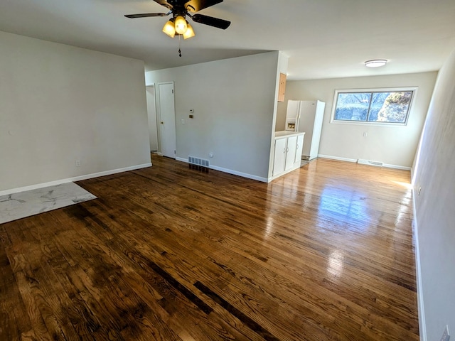 unfurnished room with ceiling fan and hardwood / wood-style floors