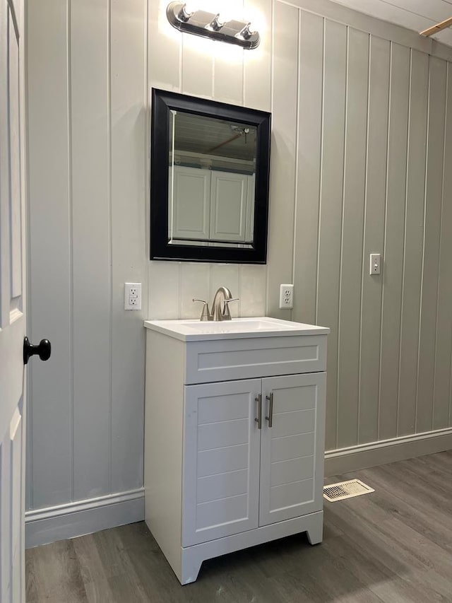 bathroom featuring vanity and hardwood / wood-style floors